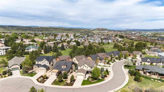 2115 Holmby Ct, Castle Rock, CO 80104 - aerial view of property and surrounding area with nearby suburban area and a mountain backdrop