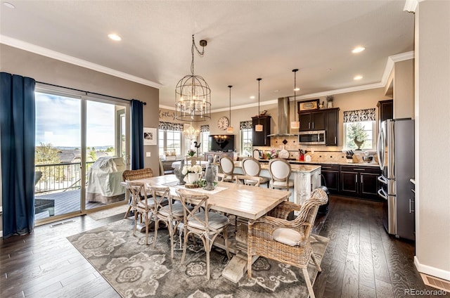 2115 Holmby Ct, Castle Rock, CO 80104 - dining area with plenty of natural light, dark wood-style flooring, a chandelier, ornamental molding, and recessed lighting