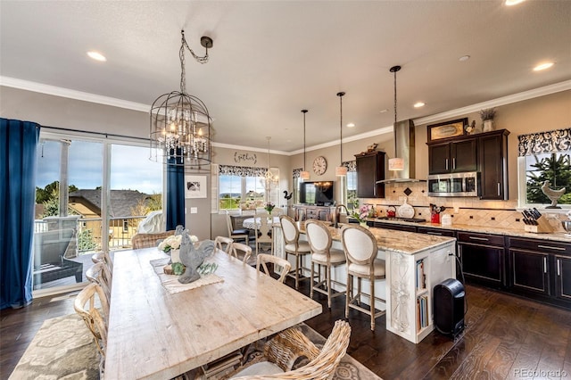 2115 Holmby Ct, Castle Rock, CO 80104 - dining room featuring a chandelier, dark wood-style floors, recessed lighting, and crown molding