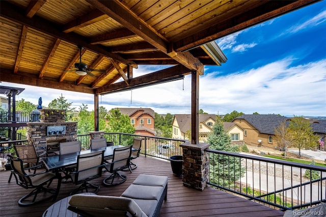 2115 Holmby Ct, Castle Rock, CO 80104 - deck with a fireplace, ceiling fan, a residential view, and outdoor dining area