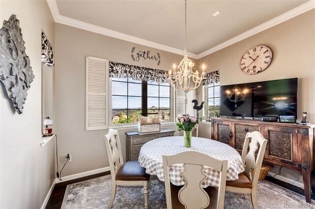 2115 Holmby Ct, Castle Rock, CO 80104 - dining room with ornamental molding, a chandelier, wood finished floors, and baseboards