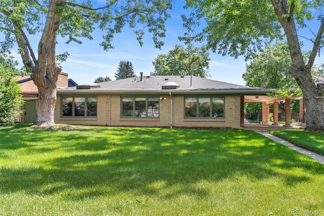 1637 S Stuart St, Denver, CO 80219 - rear view of house with a lawn and brick siding