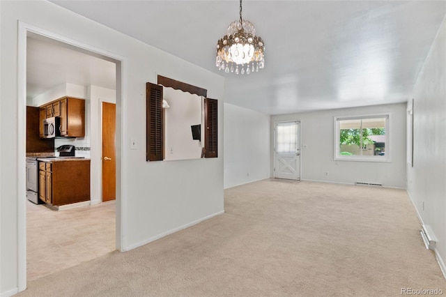 1637 S Stuart St, Denver, CO 80219 - empty room featuring light colored carpet and a chandelier
