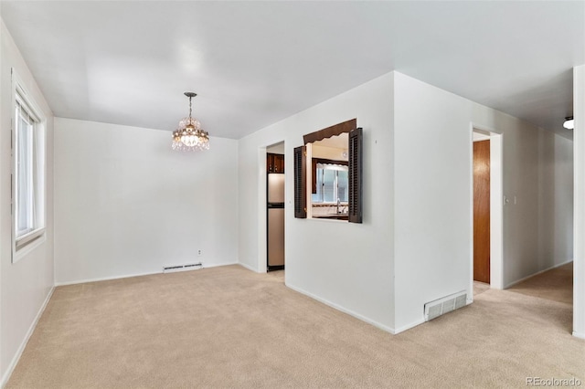 1637 S Stuart St, Denver, CO 80219 - spare room with carpet and a chandelier