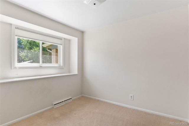 1637 S Stuart St, Denver, CO 80219 - unfurnished room featuring light carpet and baseboard heating