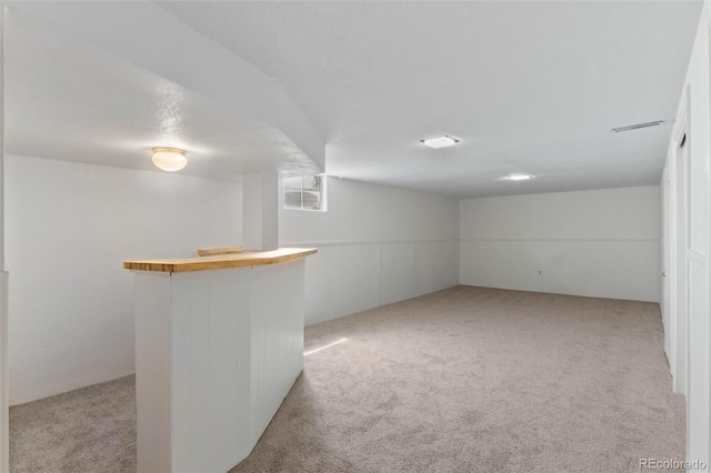 1637 S Stuart St, Denver, CO 80219 - finished basement featuring light colored carpet and a bar