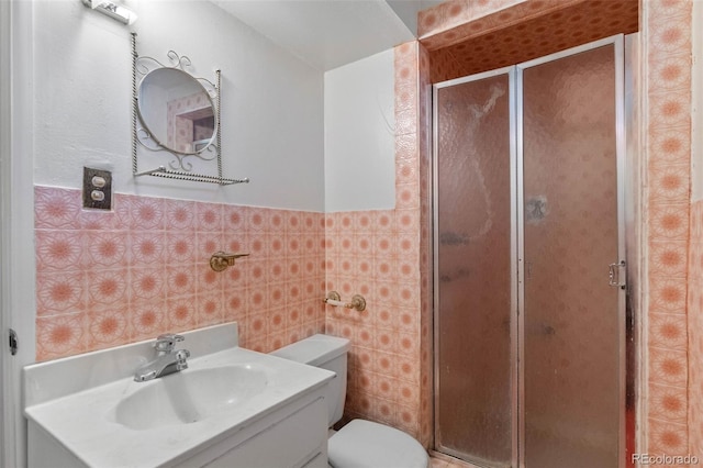 1637 S Stuart St, Denver, CO 80219 - full bath with tile walls, a shower stall, vanity, and a wainscoted wall
