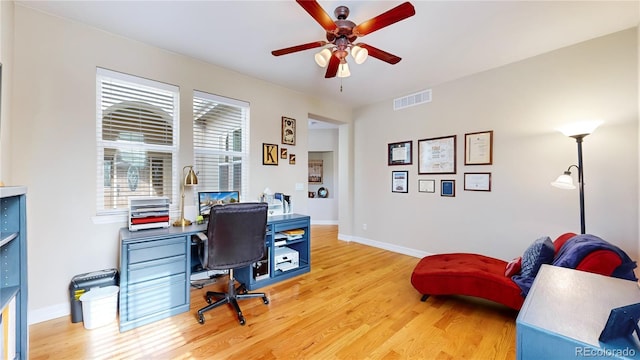 office featuring hardwood / wood-style floors and ceiling fan