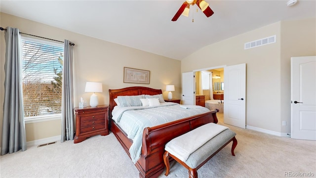 carpeted bedroom with vaulted ceiling, ensuite bathroom, and ceiling fan