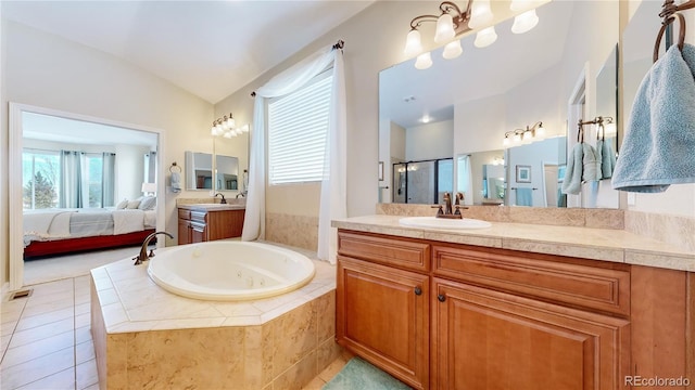 bathroom with vanity, vaulted ceiling, tile patterned floors, and plus walk in shower