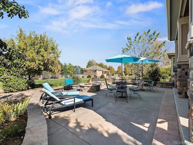 view of patio featuring a fire pit