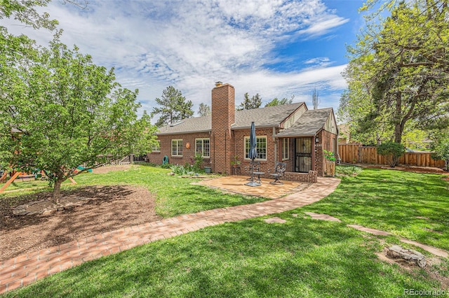 1900 Magnolia St, Denver, CO 80220 - back of house with a patio, brick siding, a chimney, and roof with shingles