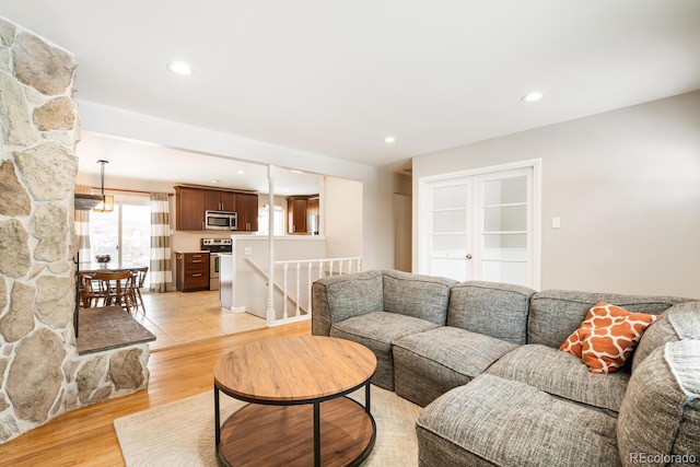 living room featuring recessed lighting and light wood-style flooring