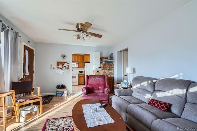 living room with ceiling fan and light wood-type flooring