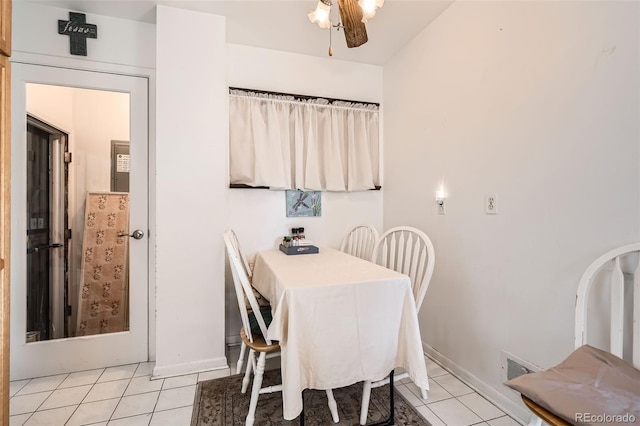 dining area featuring light tile patterned floors and ceiling fan