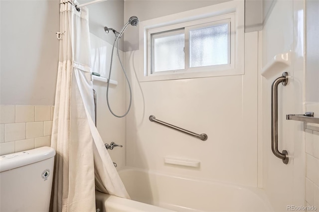 bathroom with toilet and backsplash