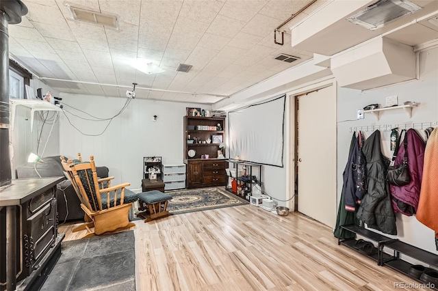 basement with hardwood / wood-style flooring