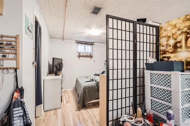 bedroom with light hardwood / wood-style flooring