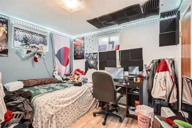 bedroom with hardwood / wood-style floors