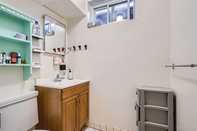 bathroom featuring vanity and toilet