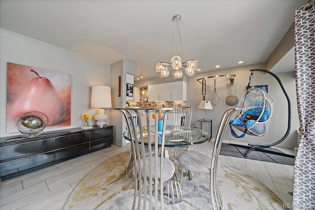 dining area with recessed lighting, baseboards, and a chandelier