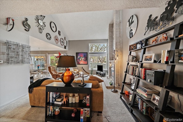 living area featuring a textured ceiling, carpet, and a wealth of natural light