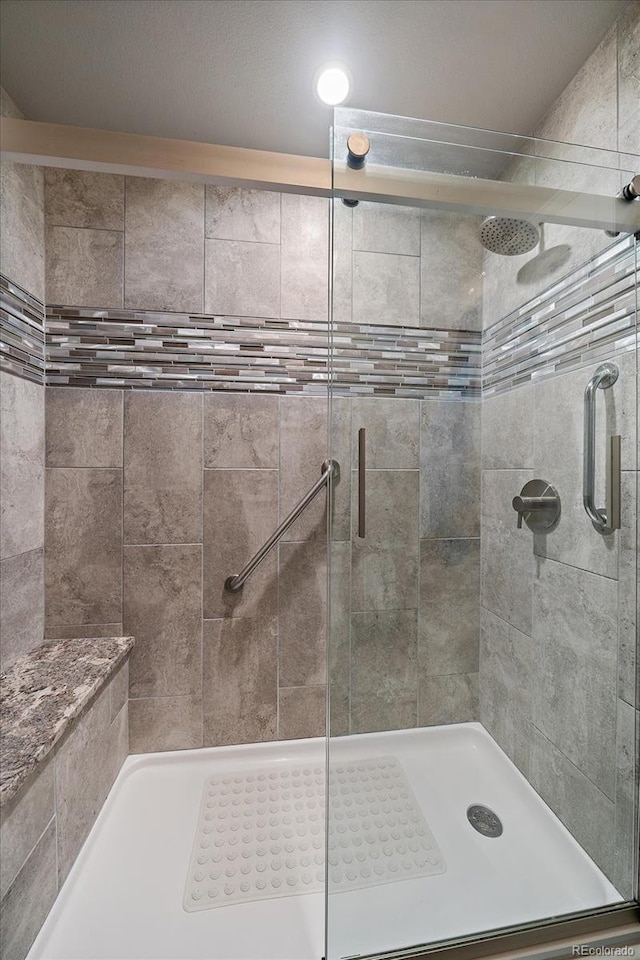 full bathroom with a shower stall