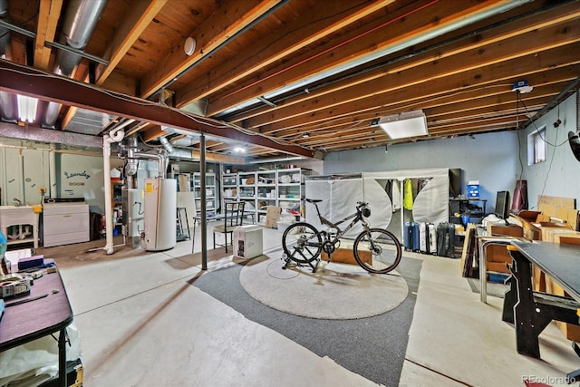 unfinished below grade area with washer / clothes dryer and water heater