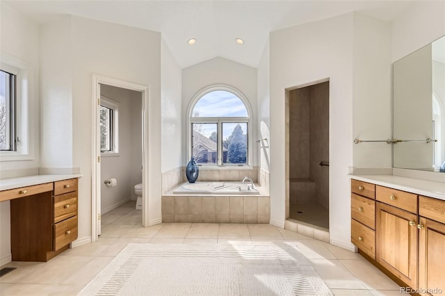 full bathroom with tile patterned floors, lofted ceiling, toilet, vanity, and independent shower and bath