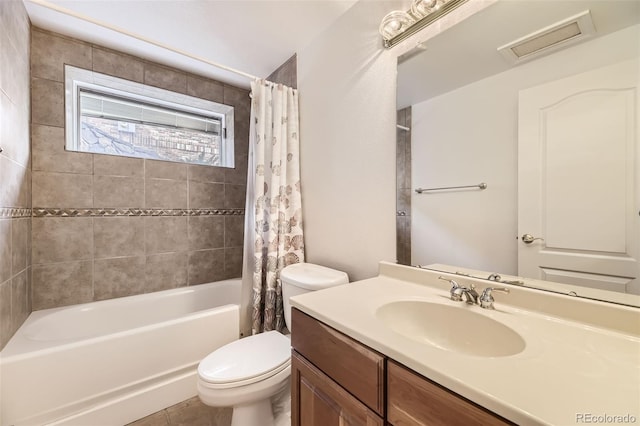 full bathroom with vanity, toilet, and shower / bath combo