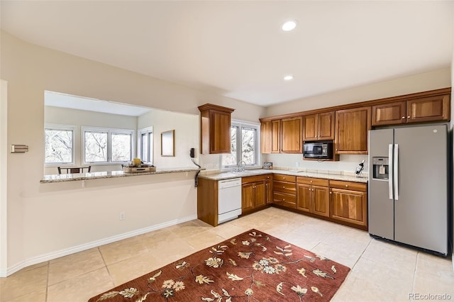 kitchen featuring stainless steel refrigerator with ice dispenser, white dishwasher, kitchen peninsula, and light tile patterned floors