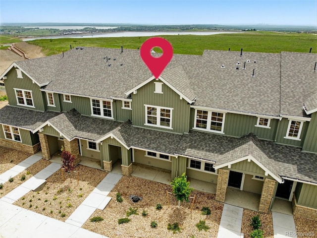 17123 W 91st Ln, Arvada, CO 80007 - multi unit property with a shingled roof, a water view, and board and batten siding