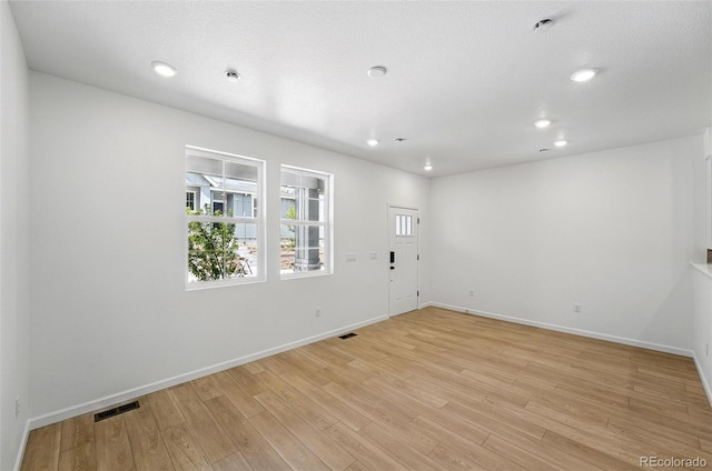 17123 W 91st Ln, Arvada, CO 80007 - unfurnished room with light wood finished floors and recessed lighting
