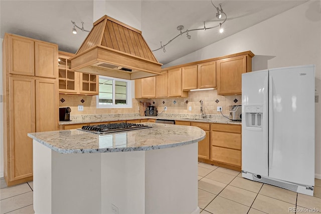 5722 W Chestnut Ave, Littleton, CO 80128 - kitchen featuring appliances with stainless steel finishes, premium range hood, lofted ceiling, a kitchen island, and track lighting