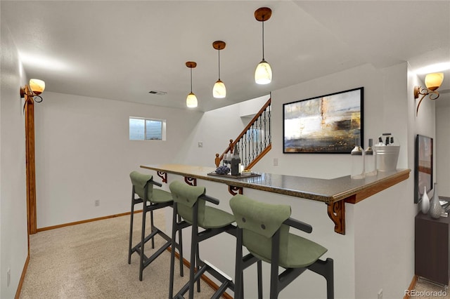 5722 W Chestnut Ave, Littleton, CO 80128 - indoor dry bar featuring stairway, light carpet, and decorative light fixtures