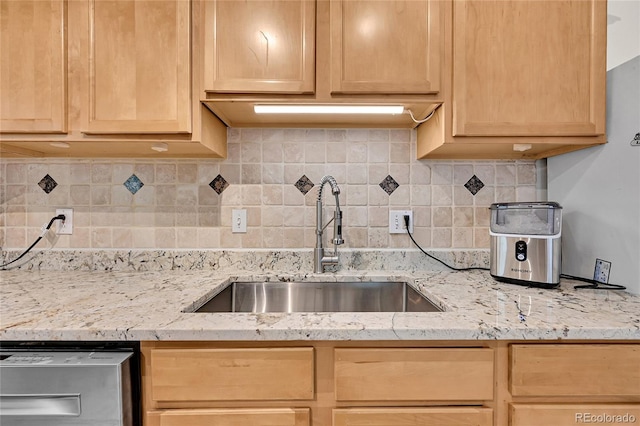5722 W Chestnut Ave, Littleton, CO 80128 - kitchen featuring stainless steel dishwasher, light brown cabinetry, backsplash, and light stone counters