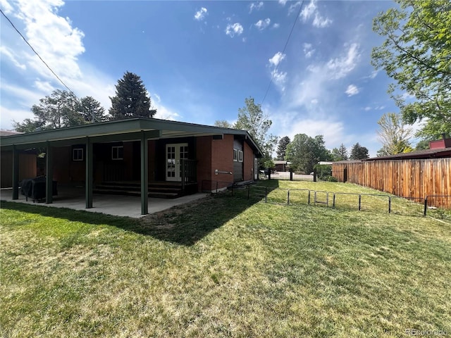 5722 W Chestnut Ave, Littleton, CO 80128 - view of yard featuring a patio