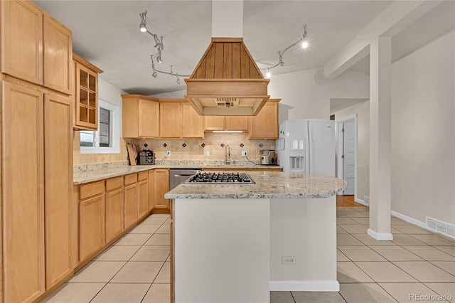 5722 W Chestnut Ave, Littleton, CO 80128 - kitchen featuring appliances with stainless steel finishes, custom range hood, light tile patterned floors, track lighting, and tasteful backsplash