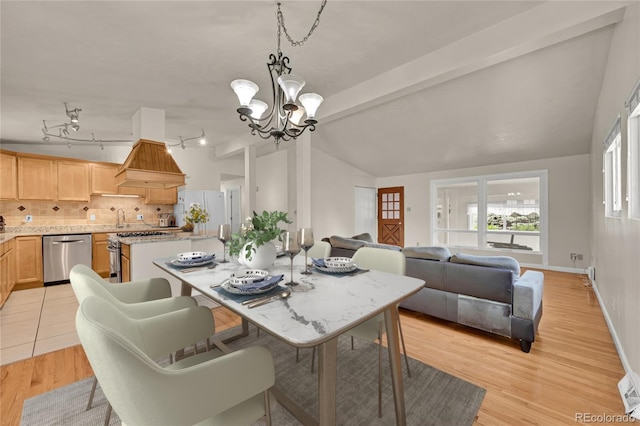 5722 W Chestnut Ave, Littleton, CO 80128 - dining area with a chandelier and light wood-type flooring