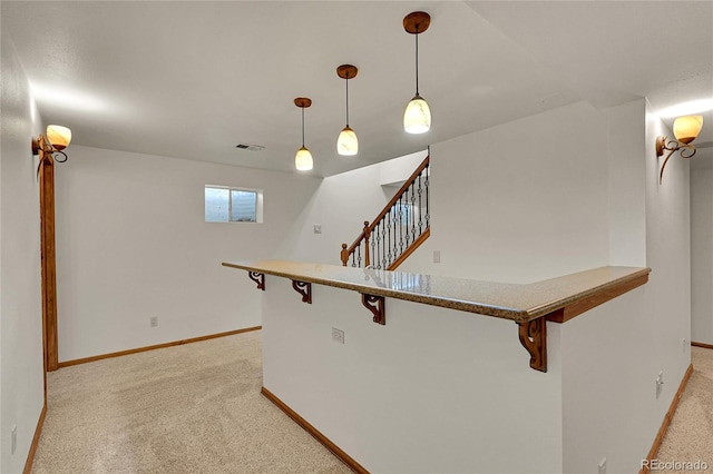 5722 W Chestnut Ave, Littleton, CO 80128 - hallway with light colored carpet and stairs