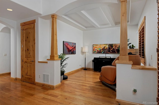 14370 Osage St, Westminster, CO 80023 - corridor with ornate columns, wood finished floors, arched walkways, baseboards, and recessed lighting