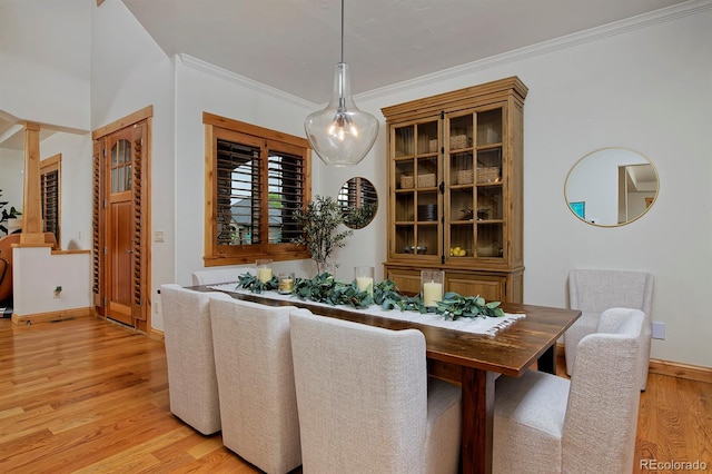 14370 Osage St, Westminster, CO 80023 - dining space with light wood-style floors, crown molding, and baseboards