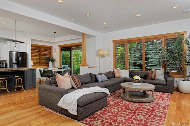 14370 Osage St, Westminster, CO 80023 - living room with plenty of natural light, light wood finished floors, and recessed lighting