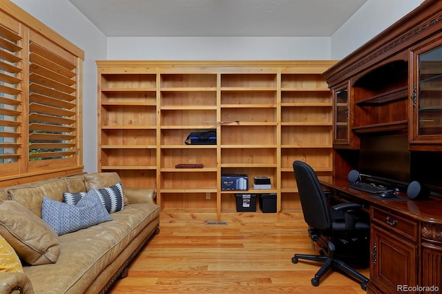 14370 Osage St, Westminster, CO 80023 - office area featuring light wood finished floors and built in study area