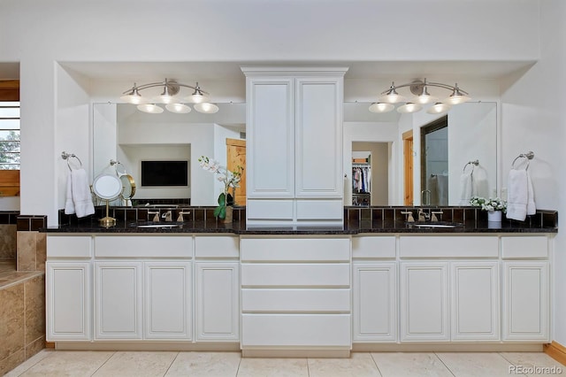 14370 Osage St, Westminster, CO 80023 - full bathroom featuring double vanity and tile patterned flooring