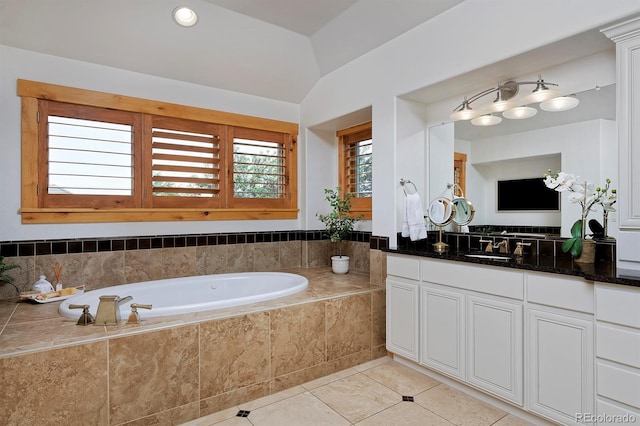 14370 Osage St, Westminster, CO 80023 - full bath with vanity, a garden tub, tile patterned flooring, and vaulted ceiling