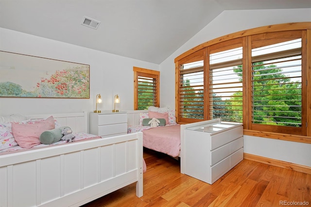 14370 Osage St, Westminster, CO 80023 - bedroom with lofted ceiling and light wood-style flooring