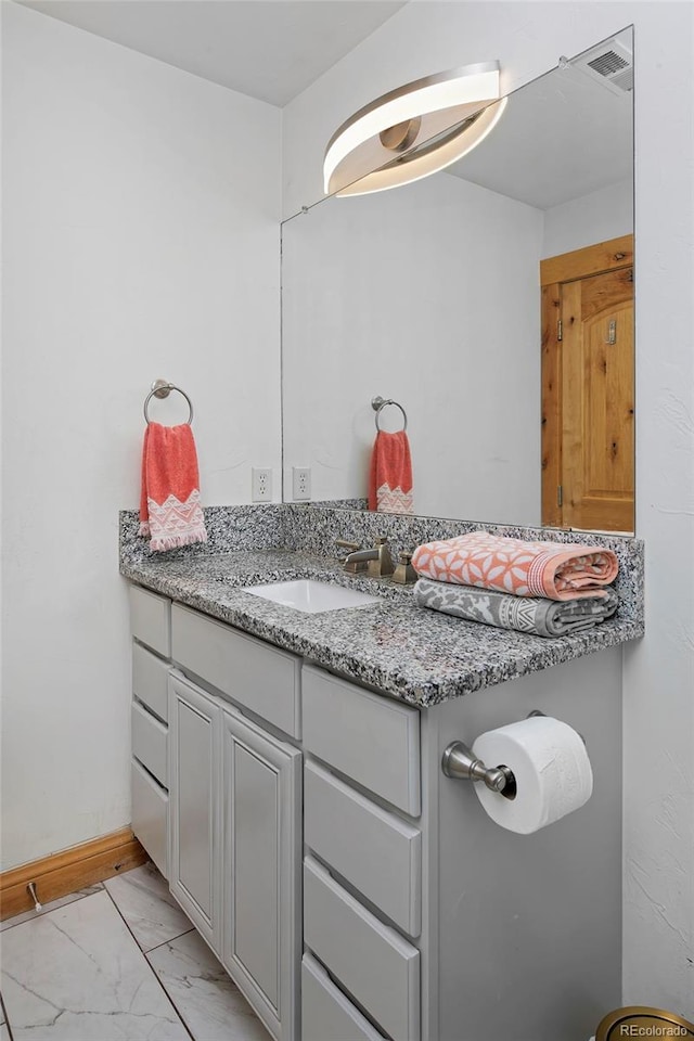 14370 Osage St, Westminster, CO 80023 - bathroom featuring marble finish floors and vanity