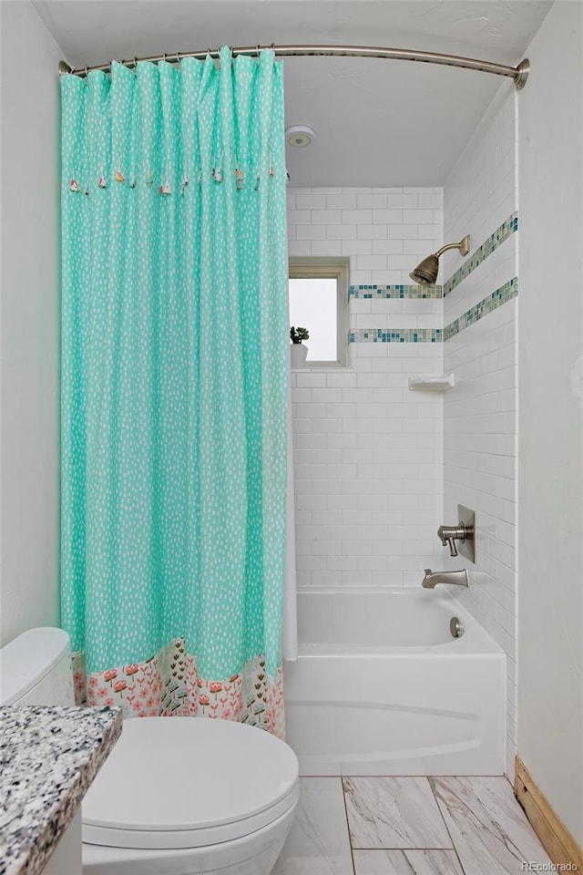 14370 Osage St, Westminster, CO 80023 - bathroom with toilet, shower / bath combination with curtain, marble finish floors, vanity, and baseboards