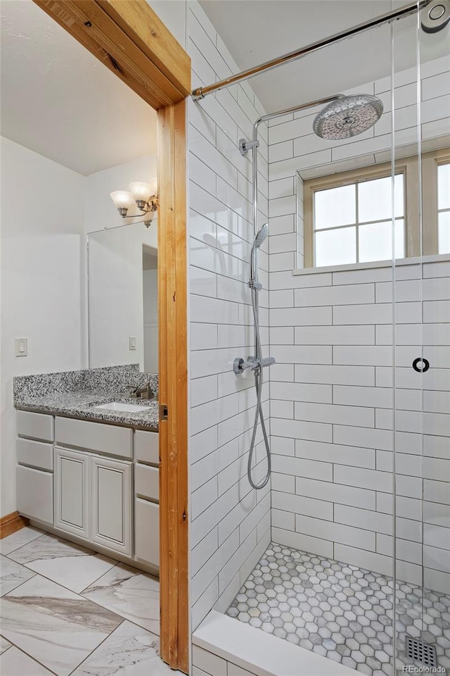 14370 Osage St, Westminster, CO 80023 - full bathroom with a stall shower, vanity, and marble look tile flooring